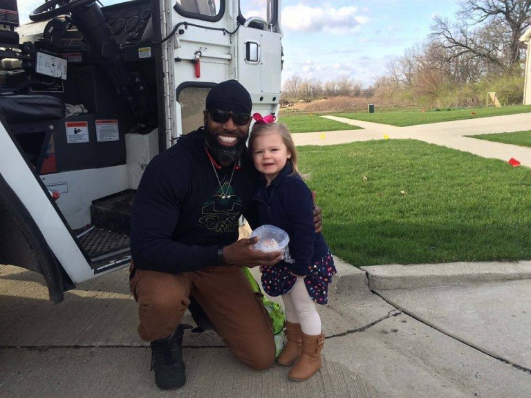 little girl meets garbage man for birthday